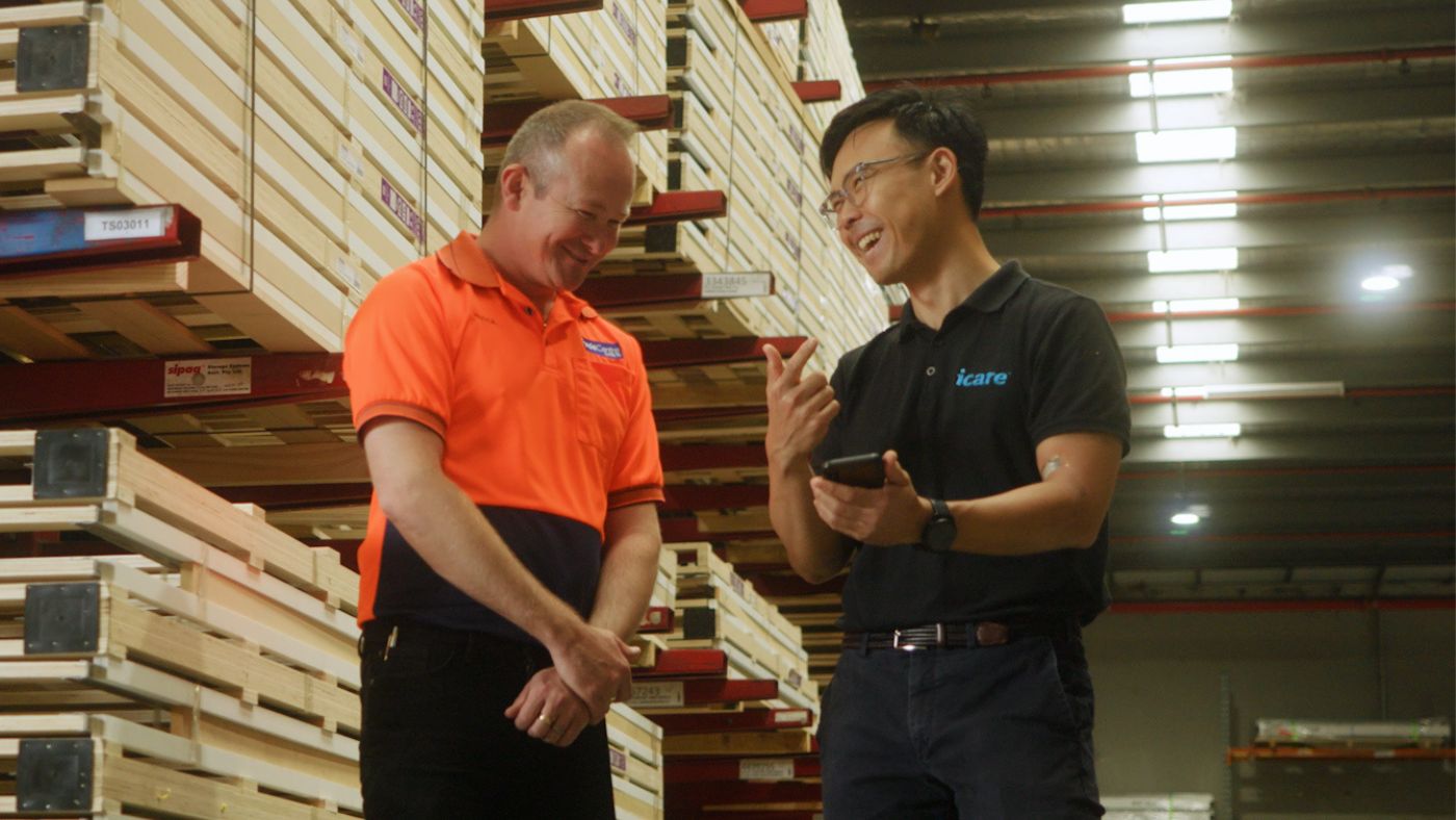 Female warehouse worker using wearable technology