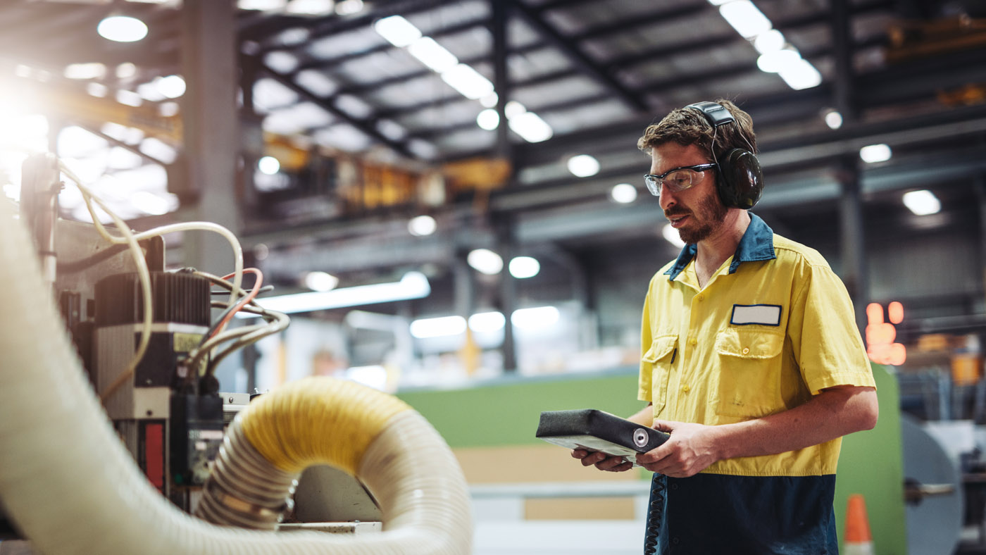 Employee in working with an automated machine