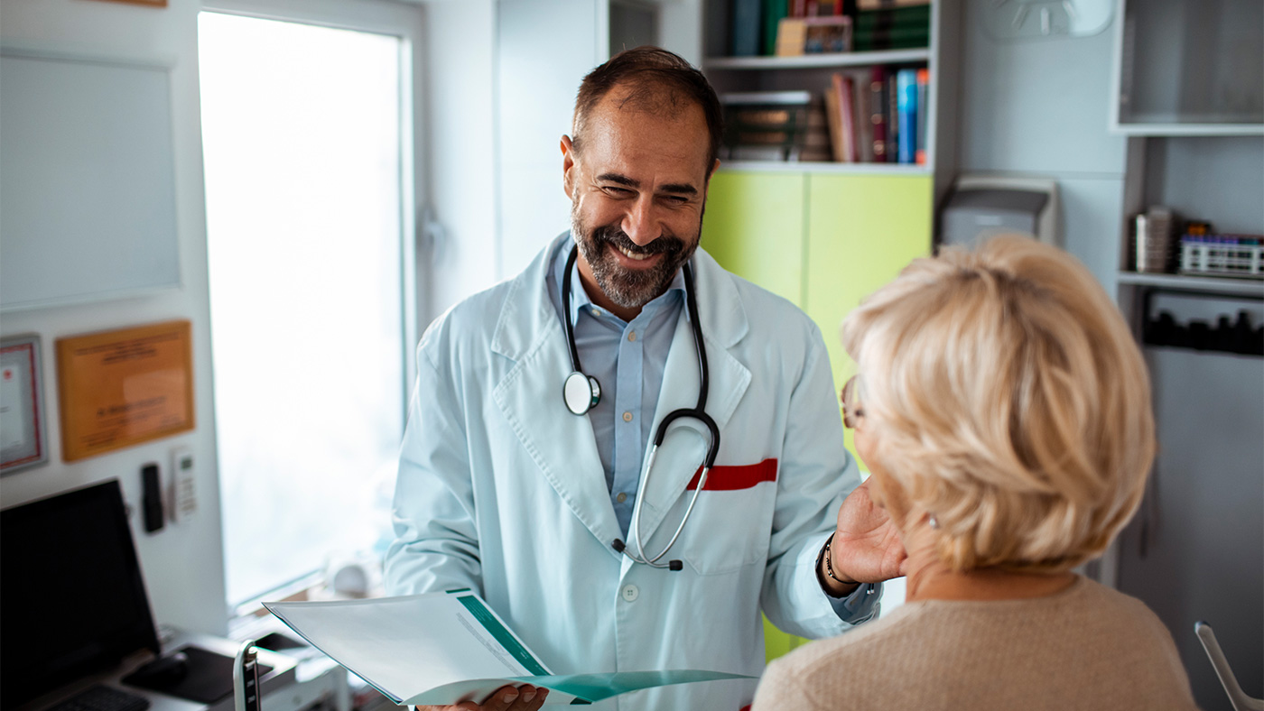 Doctor's Appointment. Close up a medical consultation between a male doctor and female patient