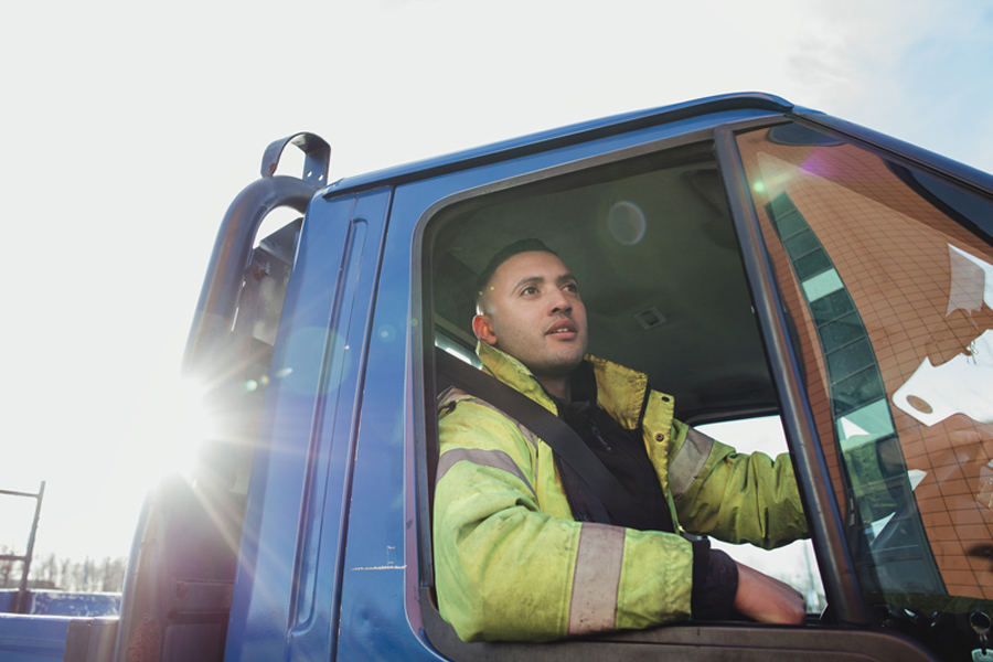 A manual worker in his van.